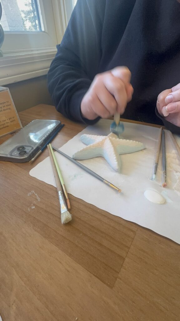 A sponge tool is being used on the starfish piece