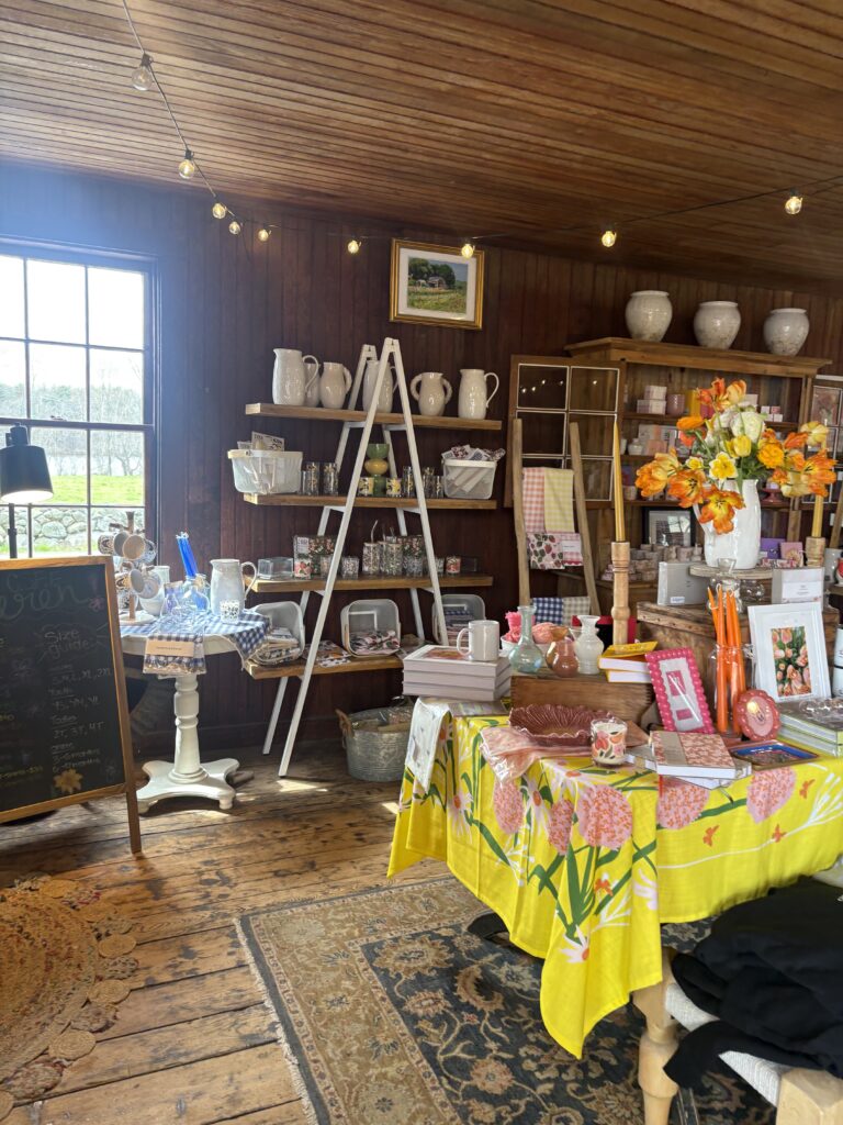 The interior of the barn store is wood and has colorful displays of housewares