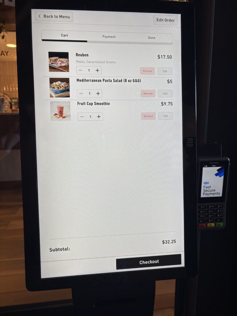 The Pressed Cafe ordering screen with a Reuben for $17.50, a Mediterranean Pasta Salad for $5 and a Fruit Cup Smoothie for $9.75. Totaling $32.35 at the bottom.
