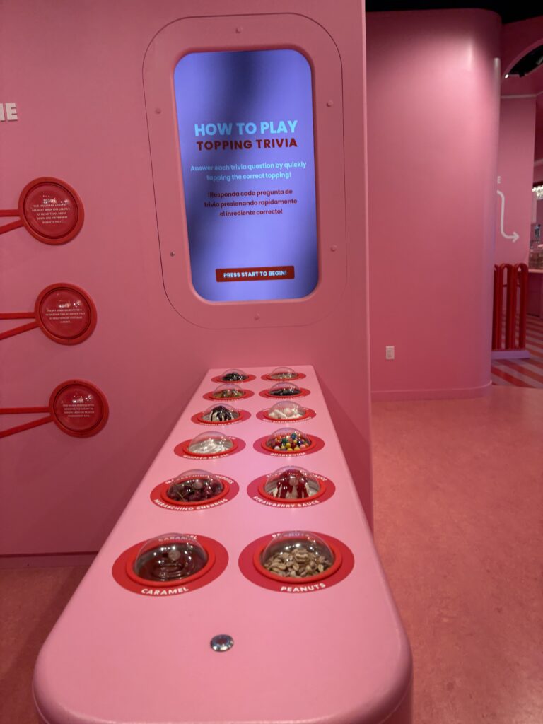 A screen that says "how to play topping trivia" with toppings buttons