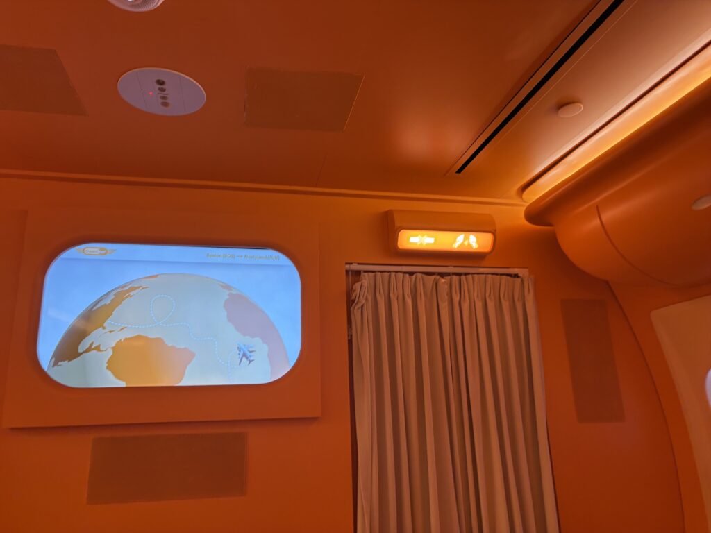 A screen that shows the Creamliner flight is going from BOS to Frostyland!